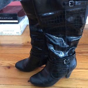 Black boots, hit about mid-calf